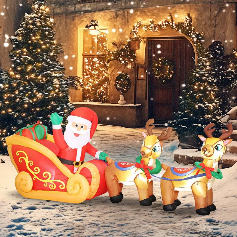 Inflatable Santa sleigh and reindeer glowing in a snowy garden at night