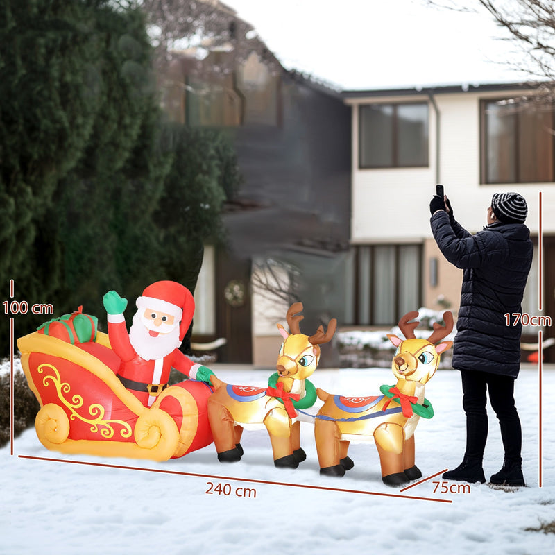 Inflatable Santa sleigh and reindeer beside a person with 240 cm length, 75 cm depth and 100 cm height labels
