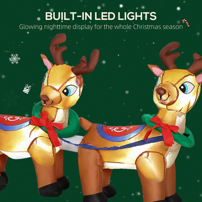 Close-up of two glowing inflatable reindeer with red bows
