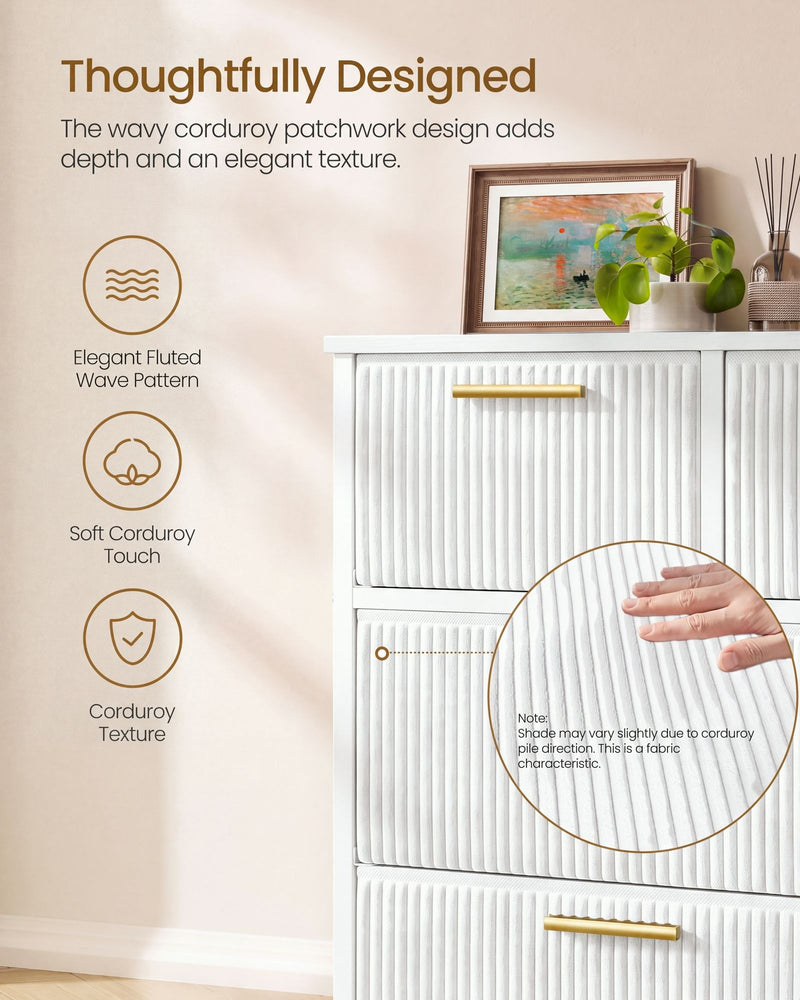 Close-up of fluted white corduroy drawer fronts with a gold handle and a hand on the fabric