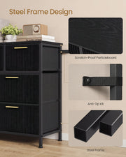 Black chest side view showing the particleboard top, anti-tip strap and steel frame