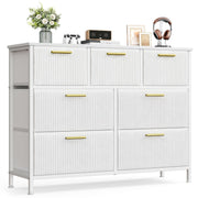 White 7-drawer corduroy chest of drawers with gold handles on a white background