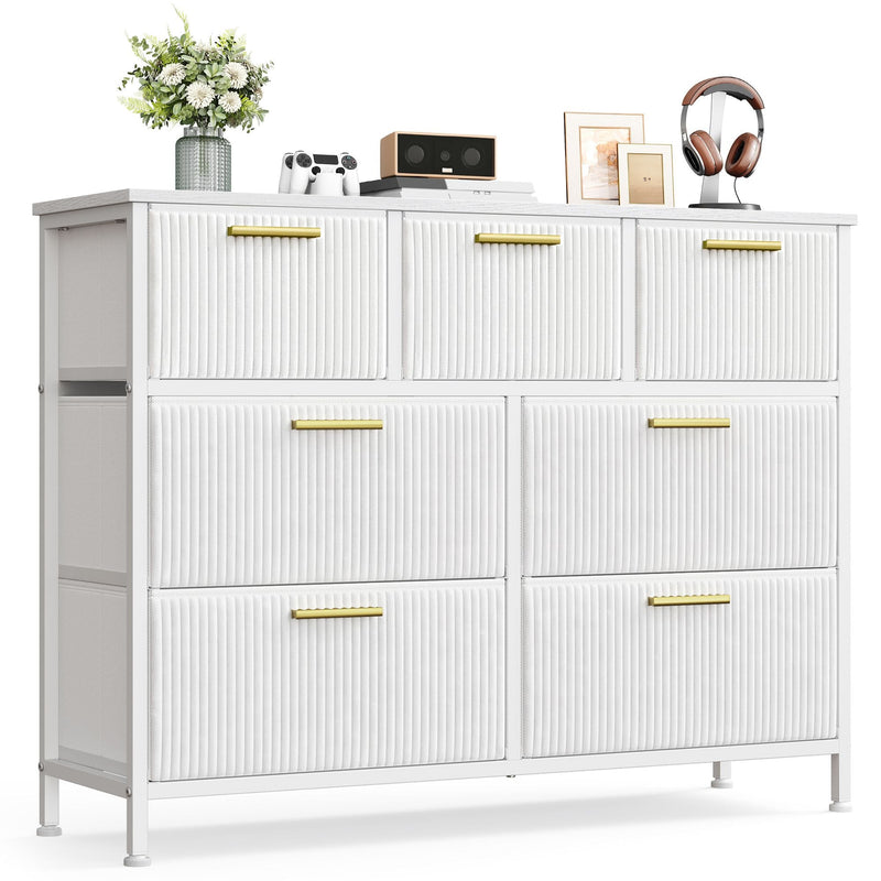 White 7-drawer corduroy chest of drawers with gold handles on a white background