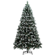 Studio shot of a 7ft snow-dipped pine Christmas tree on a black metal stand
