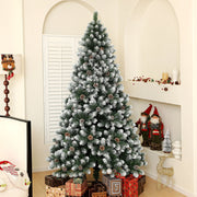 Tree beside wrapped gifts in an arched alcove