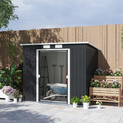 Outsunny 7x4ft pent roof shed on a patio with sliding doors open and a wheelbarrow inside