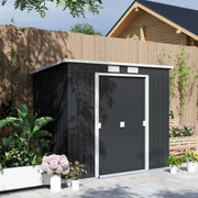 Dark grey pent roof garden shed standing against a wooden fence with the doors closed