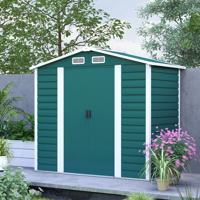 Green 7x4ft metal shed with white corner trims on a patio beside planted borders