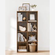 Rustic brown 8-cube bookcase styled with books, baskets and decorative objects