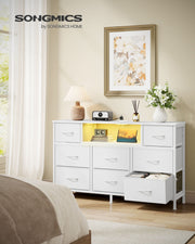Cloud white fabric chest of drawers in a bedroom with one drawer pulled open