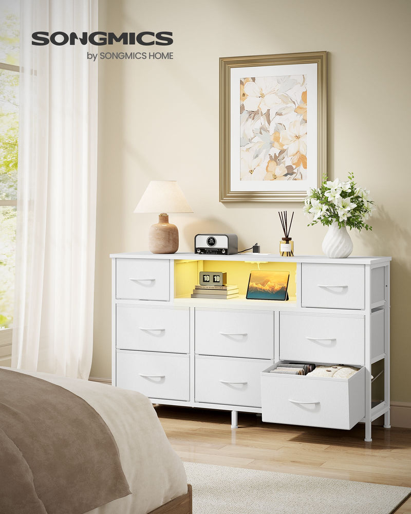 Cloud white fabric chest of drawers in a bedroom with one drawer pulled open