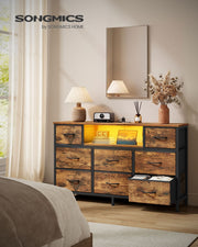 Rustic brown fabric chest of drawers in a bedroom with one drawer pulled open