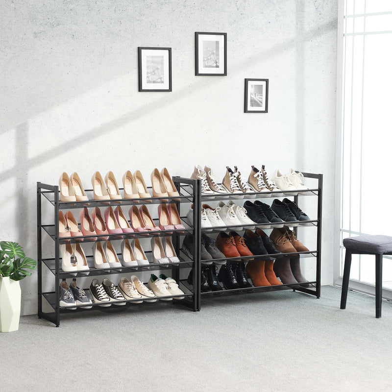 Two 4 tier black metal shoe racks placed side by side along a hallway wall, filled with shoes