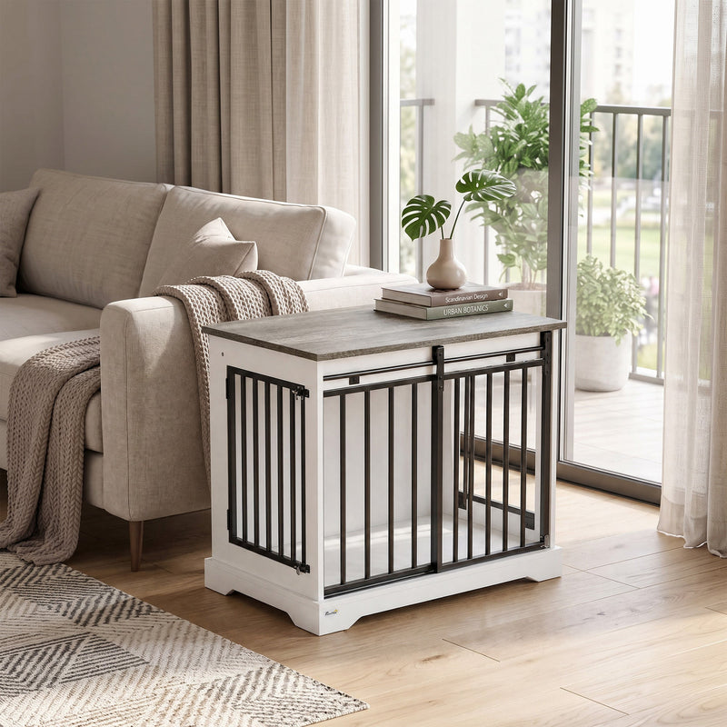 Dog crate furniture used as an end table beside a sofa near a balcony