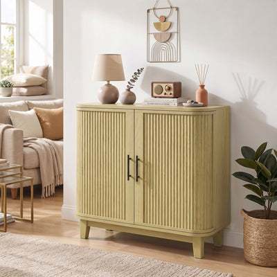 Oak sideboard styled with a lamp, radio and books in a living room