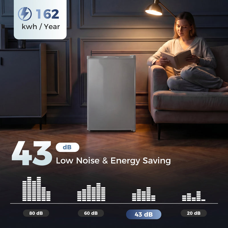 Grey mini freezer in a dim living room with 162 kWh per year and 43 dB noise infographic