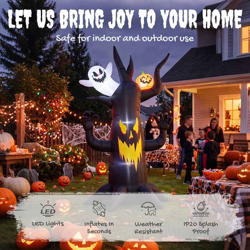 Spooky tree inflatable lit up in a garden Halloween party scene with trick-or-treaters