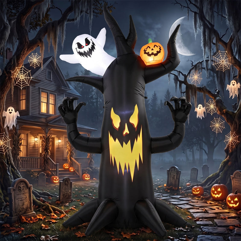 Spooky tree inflatable lit up beside a house with hanging ghosts and a crescent moon