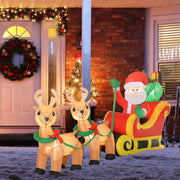 Lit inflatable Santa sleigh and two reindeer in front of a brick house with a Christmas wreath