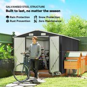 Galvanised steel garden shed with a man and bicycle at the open double doors
