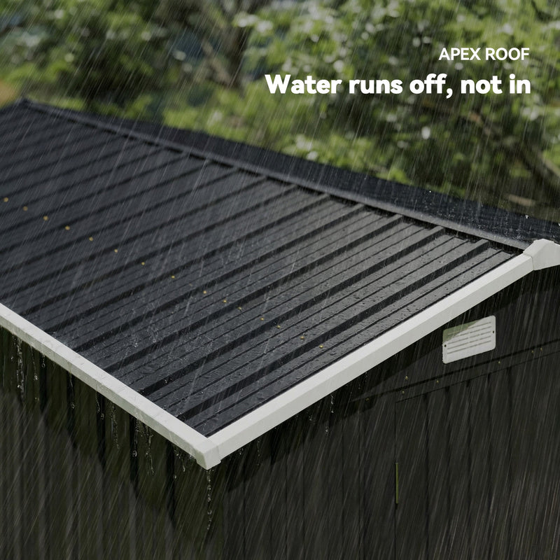 Close-up of the dark grey apex roof with rain running off
