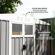 Close-up of the four louvred air vents and the two transparent windows on the light grey shed