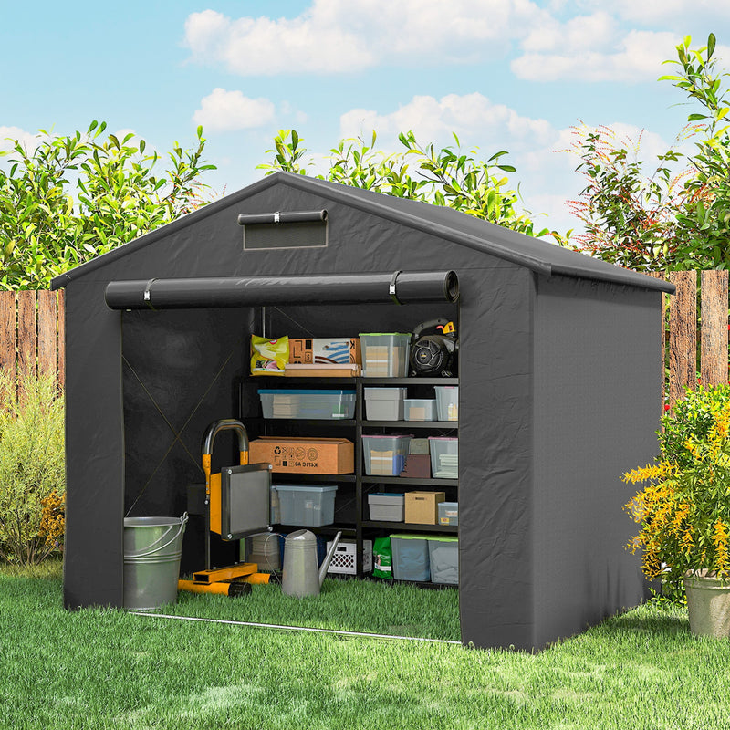 Shed with the door rolled up showing shelving, storage boxes and a work light