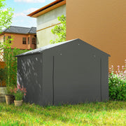 Back of the dark grey shed standing on a lawn in a garden