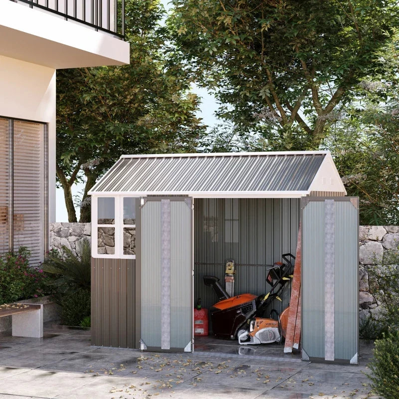 Grey shed on a paved patio with both doors open and power tools stored inside