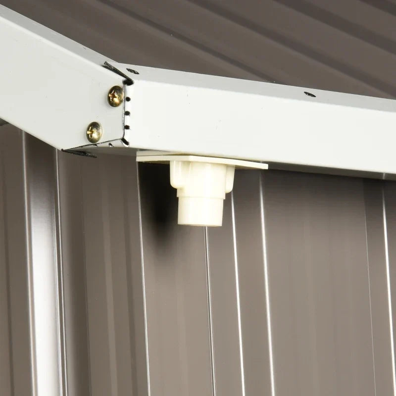 Close-up of the white roof beam bracket and plastic end cap inside the shed