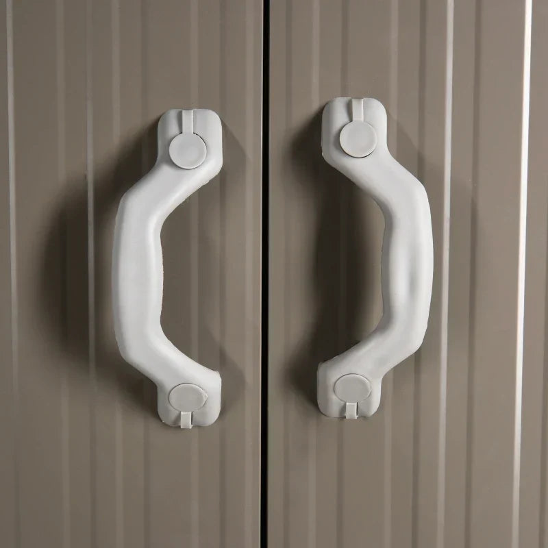Close-up of the pair of white moulded handles on the shed double doors