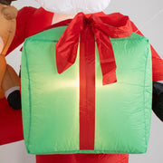 Close-up of the glowing green inflatable gift box with a red ribbon