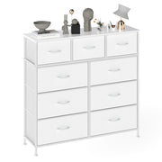 White 9-drawer chest styled with books, a lamp and stone ornaments across the top