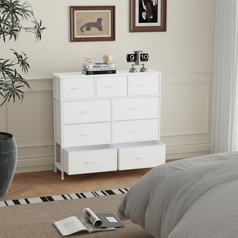 White 9-drawer chest in a bedroom with the two bottom drawers pulled fully open