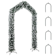 Snow-flocked Christmas tree arch with four metal ground stakes on a white background