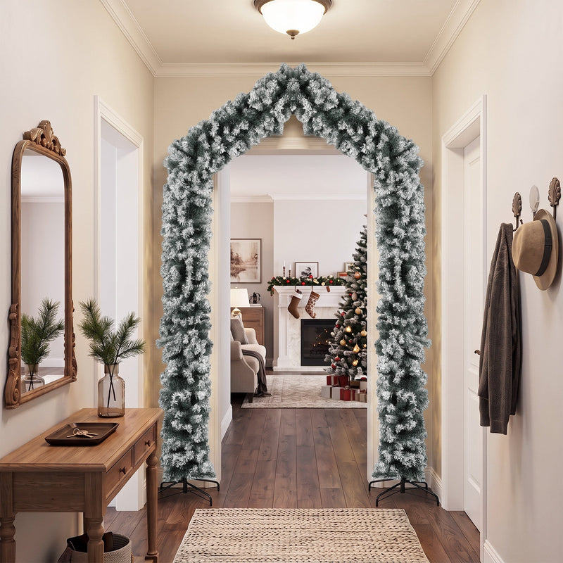 Flocked Christmas arch in a hallway with a console table and coat hooks