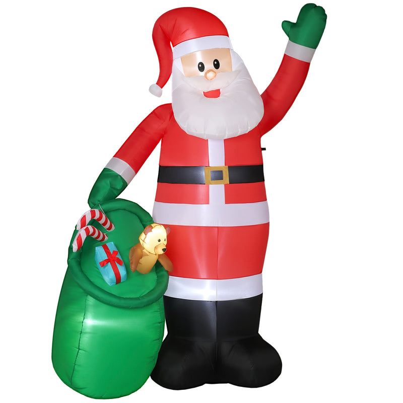 Inflatable Santa waving beside a green toy sack on a white background