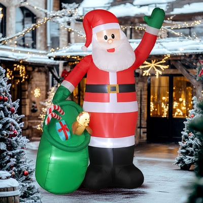 Inflatable Santa in front of a snowy house at dusk
