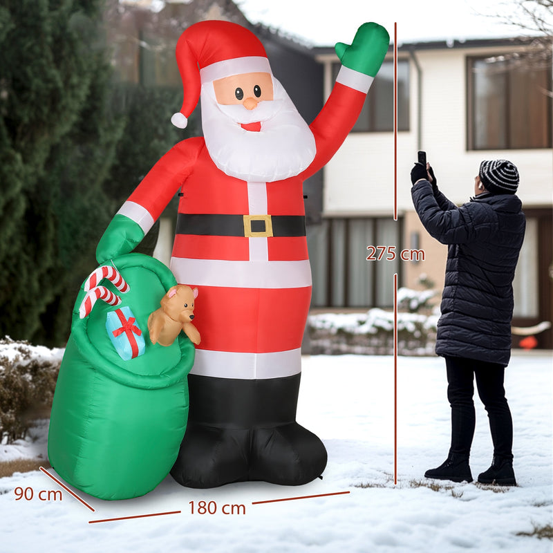 Inflatable Santa beside a person with 275 cm height, 180 cm width and 90 cm depth labels
