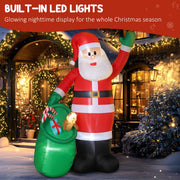 Inflatable Santa lit by built-in LED lights in front of a decorated house