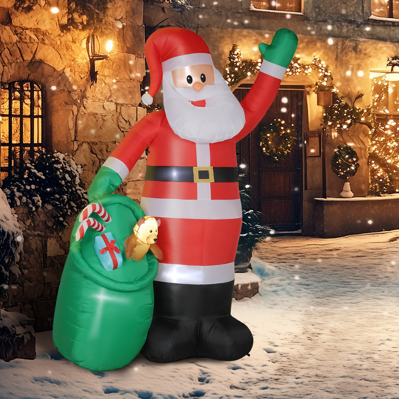 Inflatable Santa lit up beside a stone house at night
