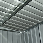 View up at the shed's internal roof structure showing the steel purlins and ribbed roof panels