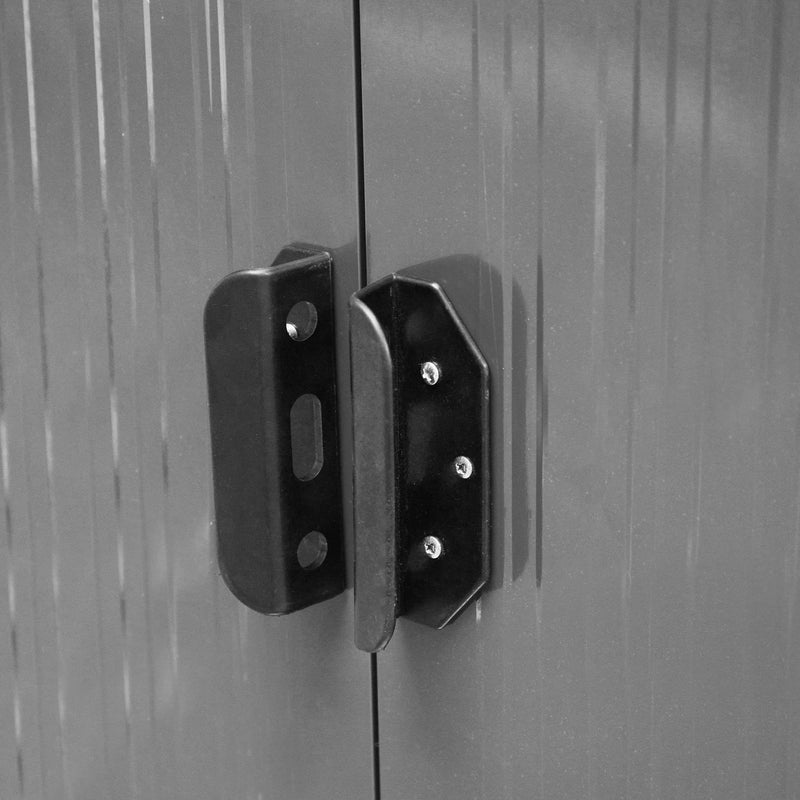 Close-up of the black door handle and catch where the two sliding doors meet