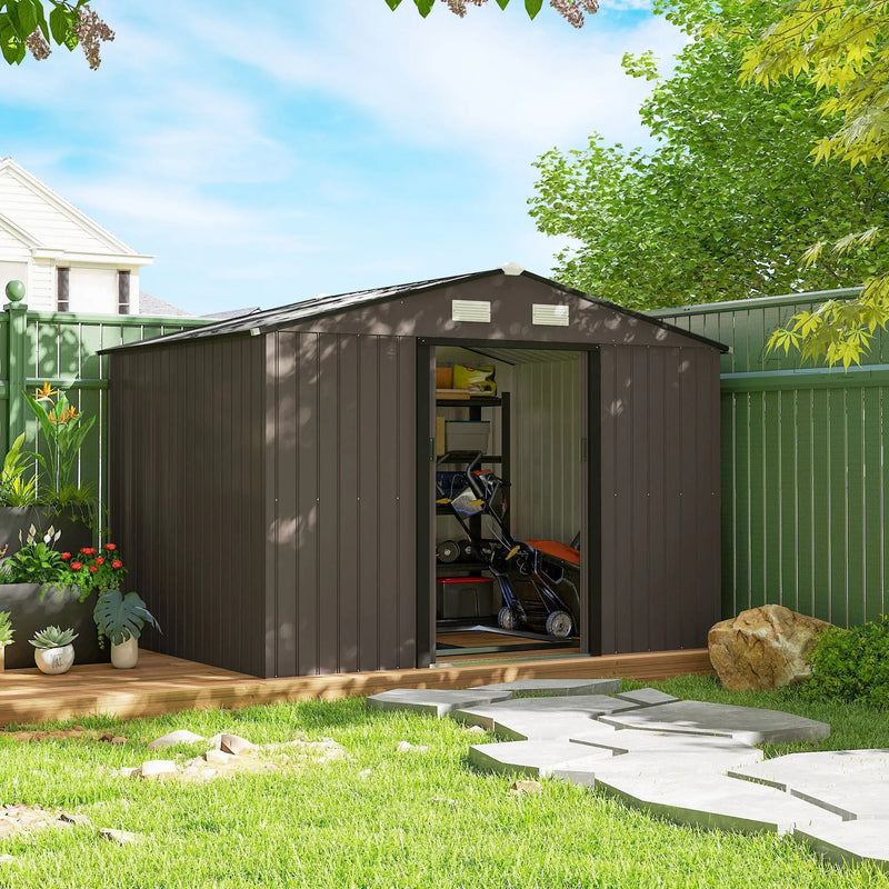 Brown metal shed beside a green garden fence with equipment visible through the open doors