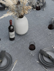 Grey ceramic round table top and rope chair detail on the Aspen 6 seater garden dining set