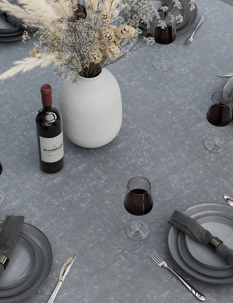 Grey ceramic round table top and rope chair detail on the Aspen 6 seater garden dining set