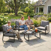 Family sitting on outdoor patio furniture in a garden setting