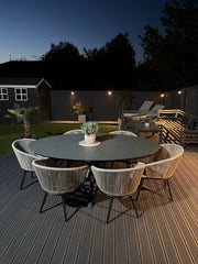 Aspen 6 seater oval ceramic glass garden dining set with black frame and six grey rope chairs