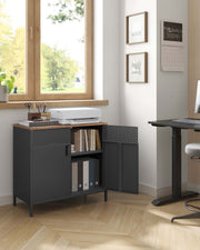 Rustic brown and black Vasagle storage cabinet holding books and files in a home office