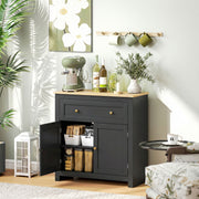 Black cabinet with open door displaying items, placed in a room with decor elements like a coffee machine and plants.